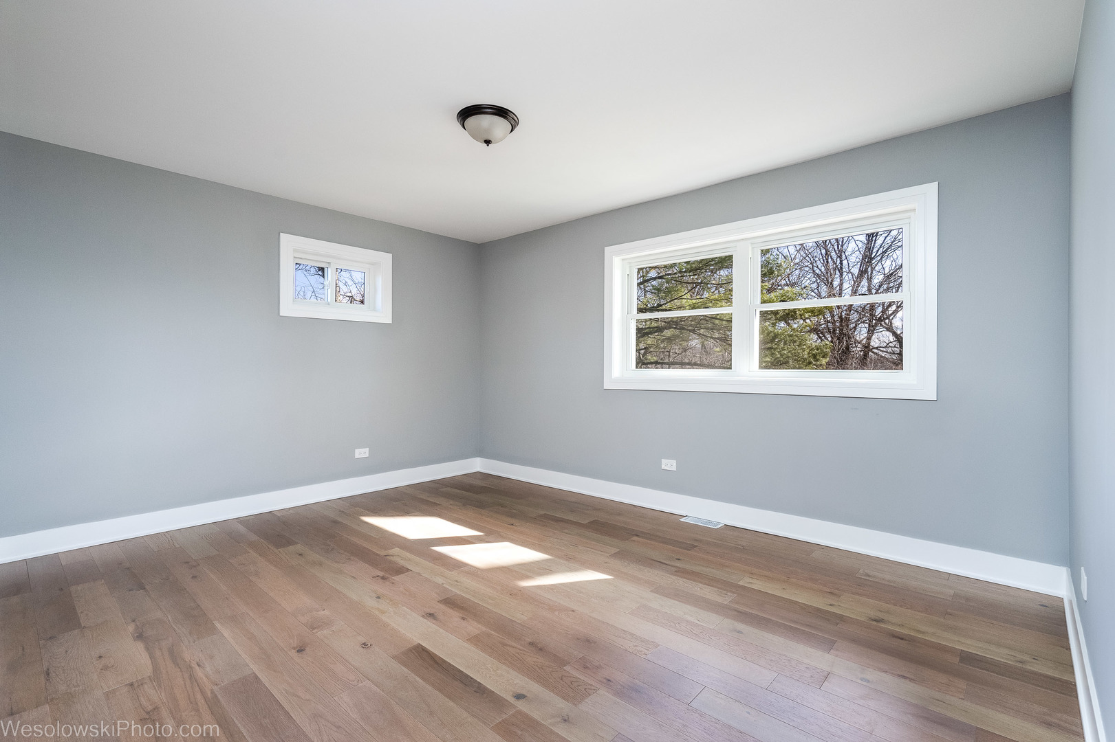 820 Exmoor Road Olympia Fields, IL 60461 - Photo 19 of 35 an empty room with wooden floor and windows