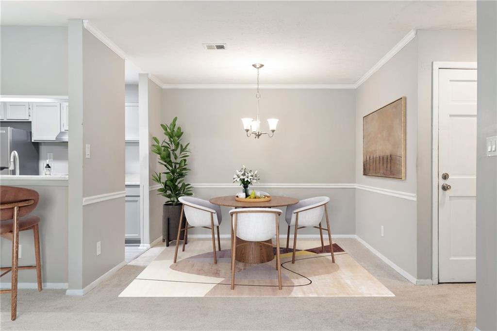 1009 McClelen Way Decatur, GA 30033 - Photo 3 of 24 a view of a dining room with furniture and wooden floor