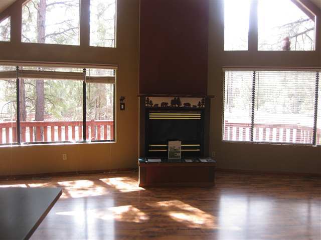 2939 Ransack Road Overgaard, AZ 85933 - Photo 3 of 5 a living room with hard wood floors and a window