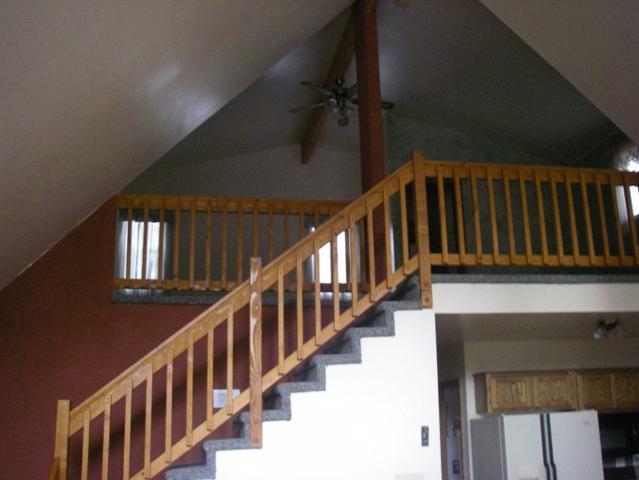2939 Ransack Road Overgaard, AZ 85933 - Photo 4 of 5 a view of staircase with lots of frames on wall and a window