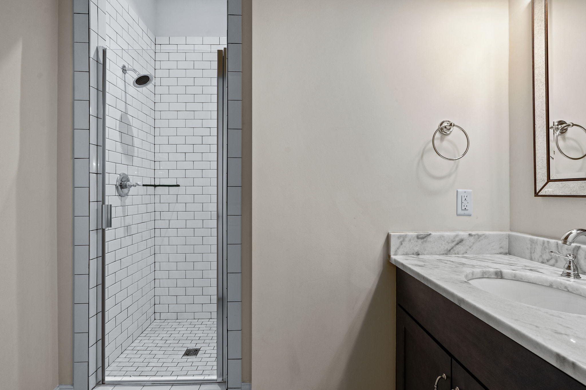 4048 General Martin Lane Franklin, TN 37064 - Photo 29 of 57 a bathroom with a granite countertop sink a shower and mirror