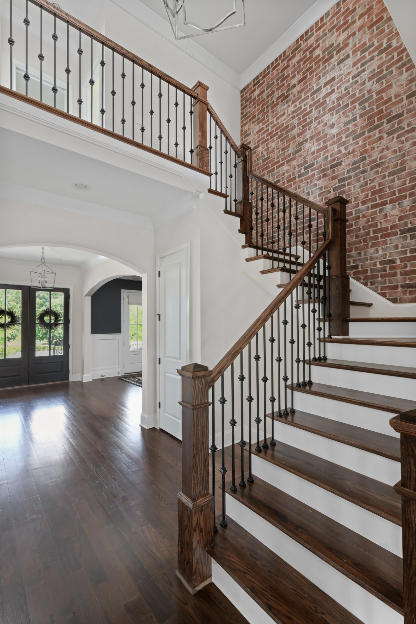 4048 General Martin Lane Franklin, TN 37064 - Photo 30 of 57 a view of staircase with wooden floor and a fireplace