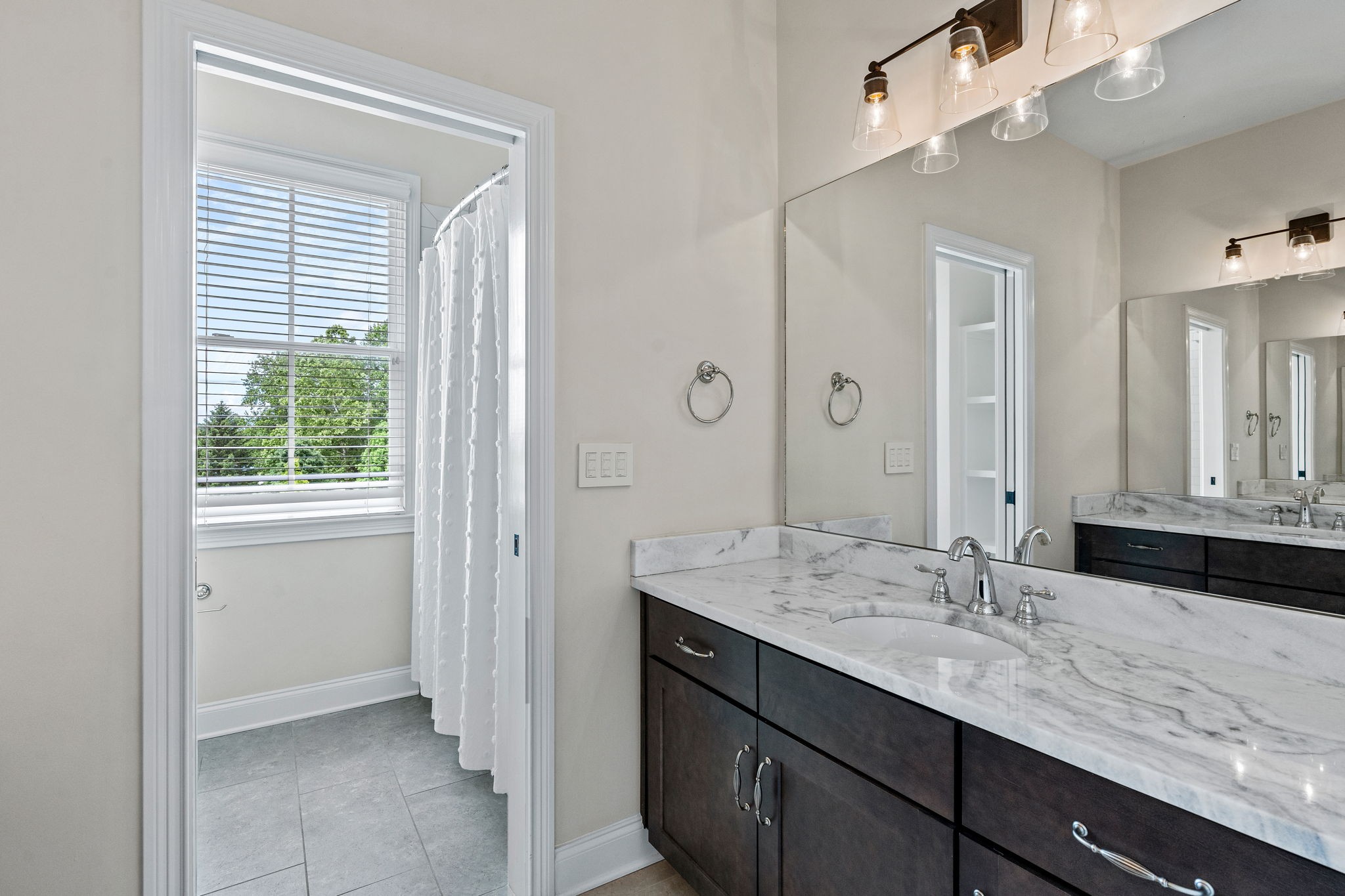 4048 General Martin Lane Franklin, TN 37064 - Photo 37 of 57 a bathroom with a granite countertop sink and a mirror