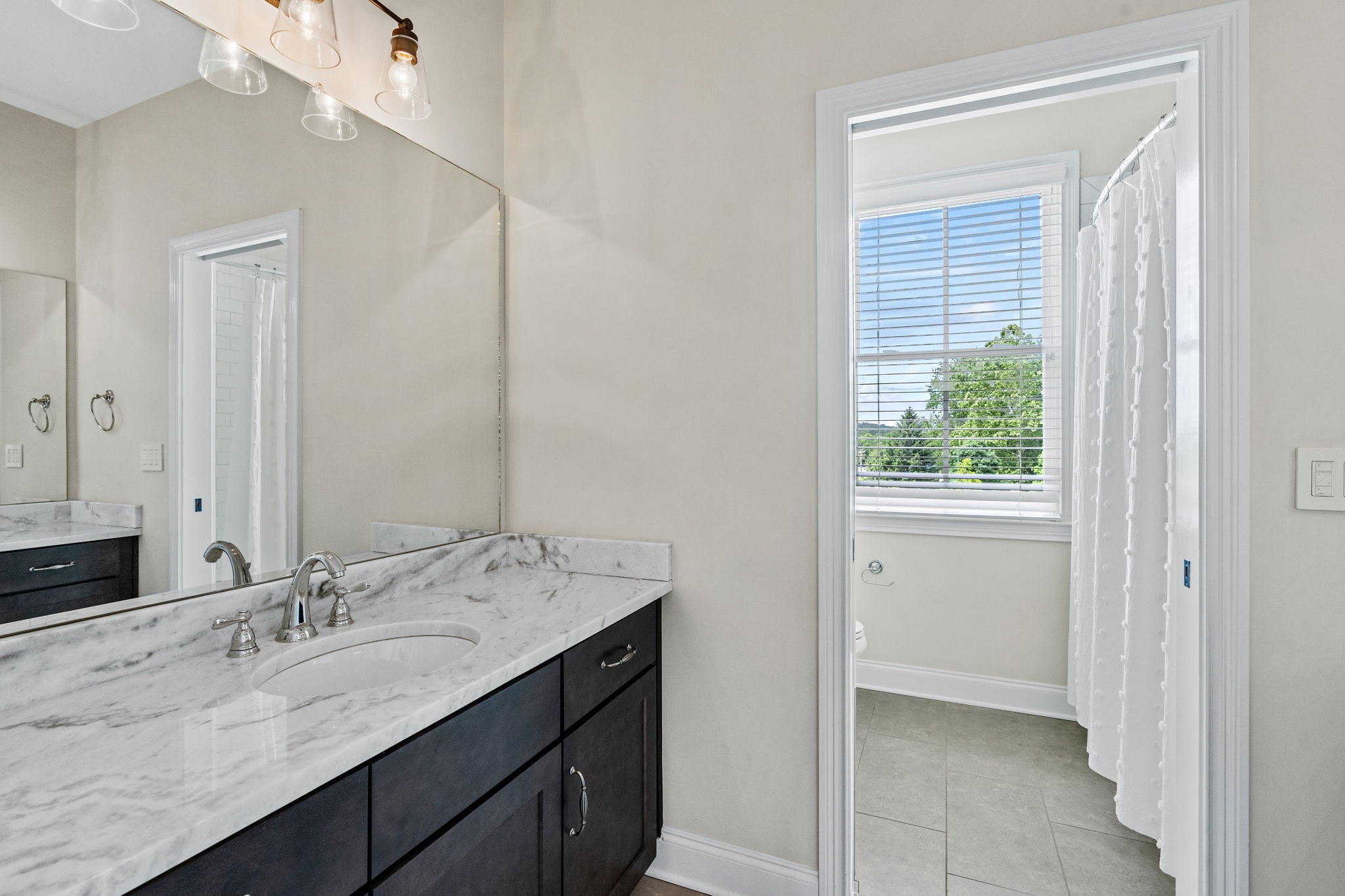 4048 General Martin Lane Franklin, TN 37064 - Photo 38 of 57 a bathroom with a granite countertop sink and a mirror