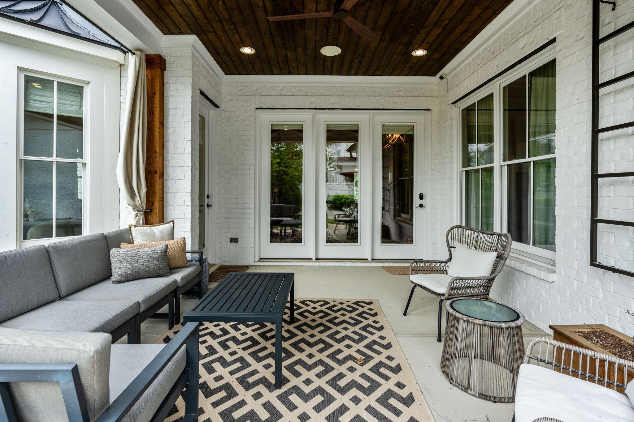 4048 General Martin Lane Franklin, TN 37064 - Photo 43 of 57 a view of a patio with couches chairs and wooden floor