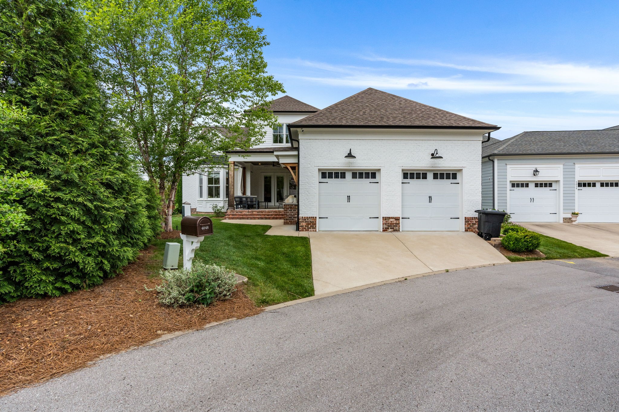 4048 General Martin Lane Franklin, TN 37064 - Photo 45 of 57 a front view of a house with a yard and garage