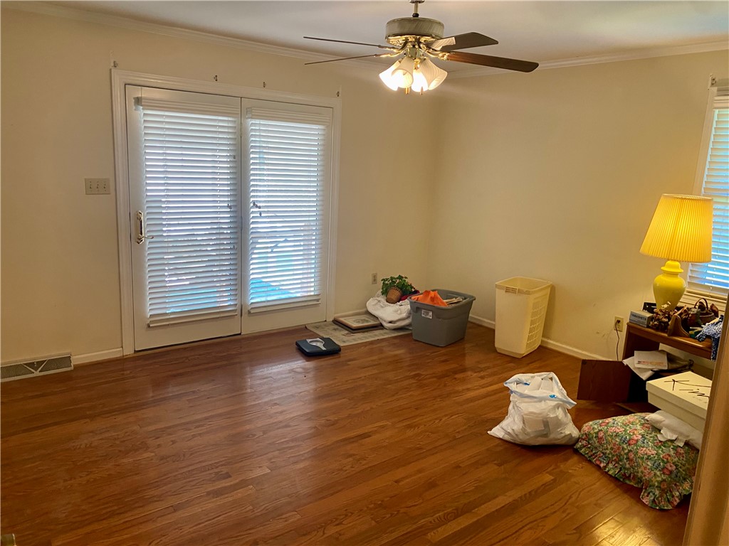 327 Five Forks Road Anderson, SC 29621 - Photo 22 of 31 Gleaming hardwood floors and a sliding glass door define this primary bedroom.