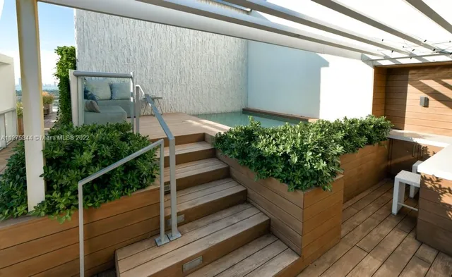 a view of a backyard with sitting area