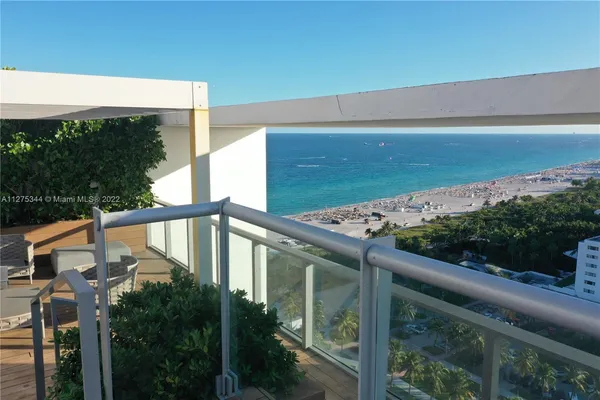a balcony with wooden floor
