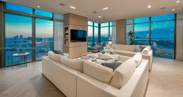a living room with furniture fireplace and a flat screen tv