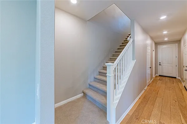 a view of a hallway with staircase