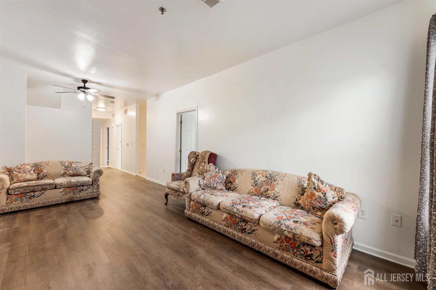 128 Remsen Avenue, Unit A New Brunswick, NJ 08901 - Photo 6 of 18 a living room with furniture and a couch