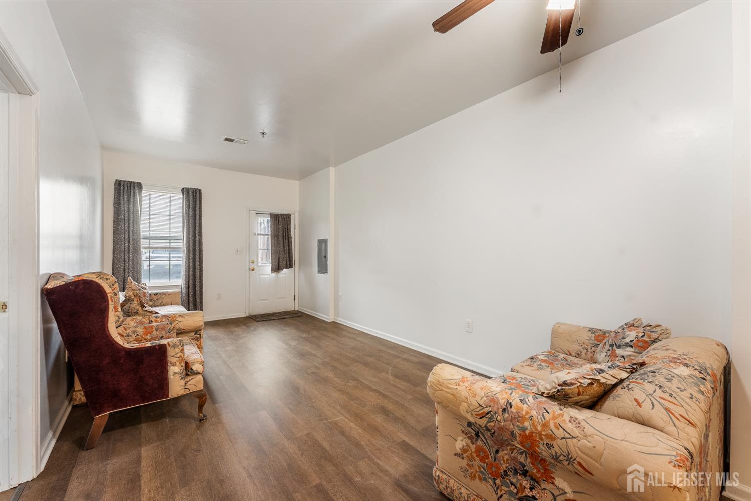 128 Remsen Avenue, Unit A New Brunswick, NJ 08901 - Photo 7 of 18 a living room with furniture and wooden floor