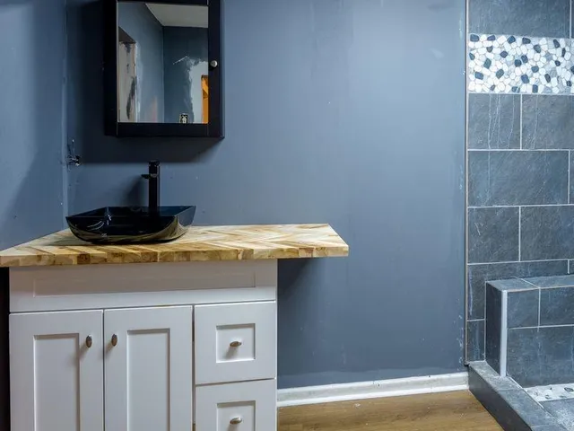 a bathroom with a sink and a mirror