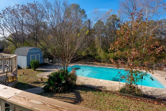 a view of a garden with a patio