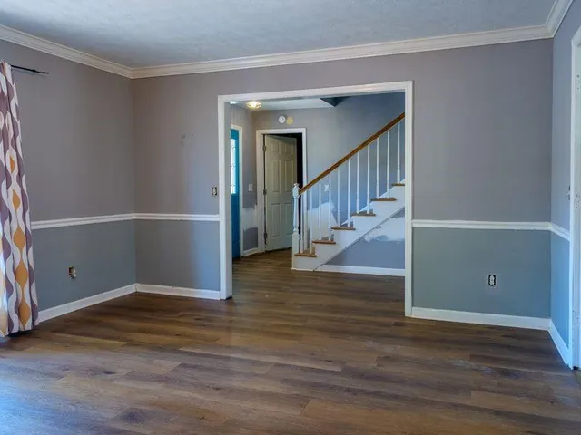 a view of entryway with wooden floor