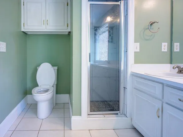 a bathroom with a toilet and a sink
