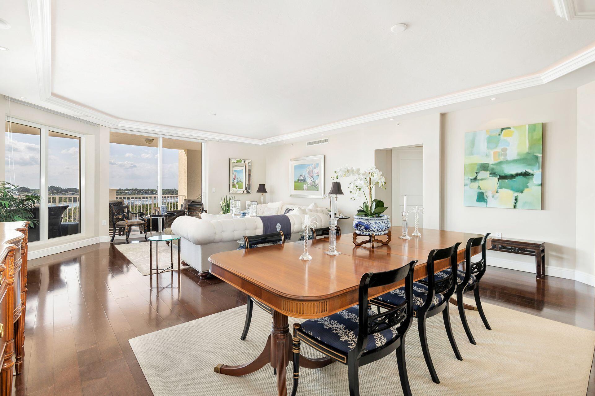 700 Highway 1, Unit 401 Jupiter, FL 33477 - Photo 11 of 39 a view of a dining room with furniture window and wooden floor