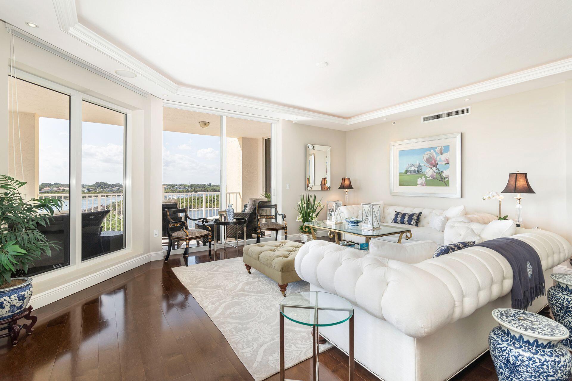 700 Highway 1, Unit 401 Jupiter, FL 33477 - Photo 12 of 39 a living room with furniture and large windows