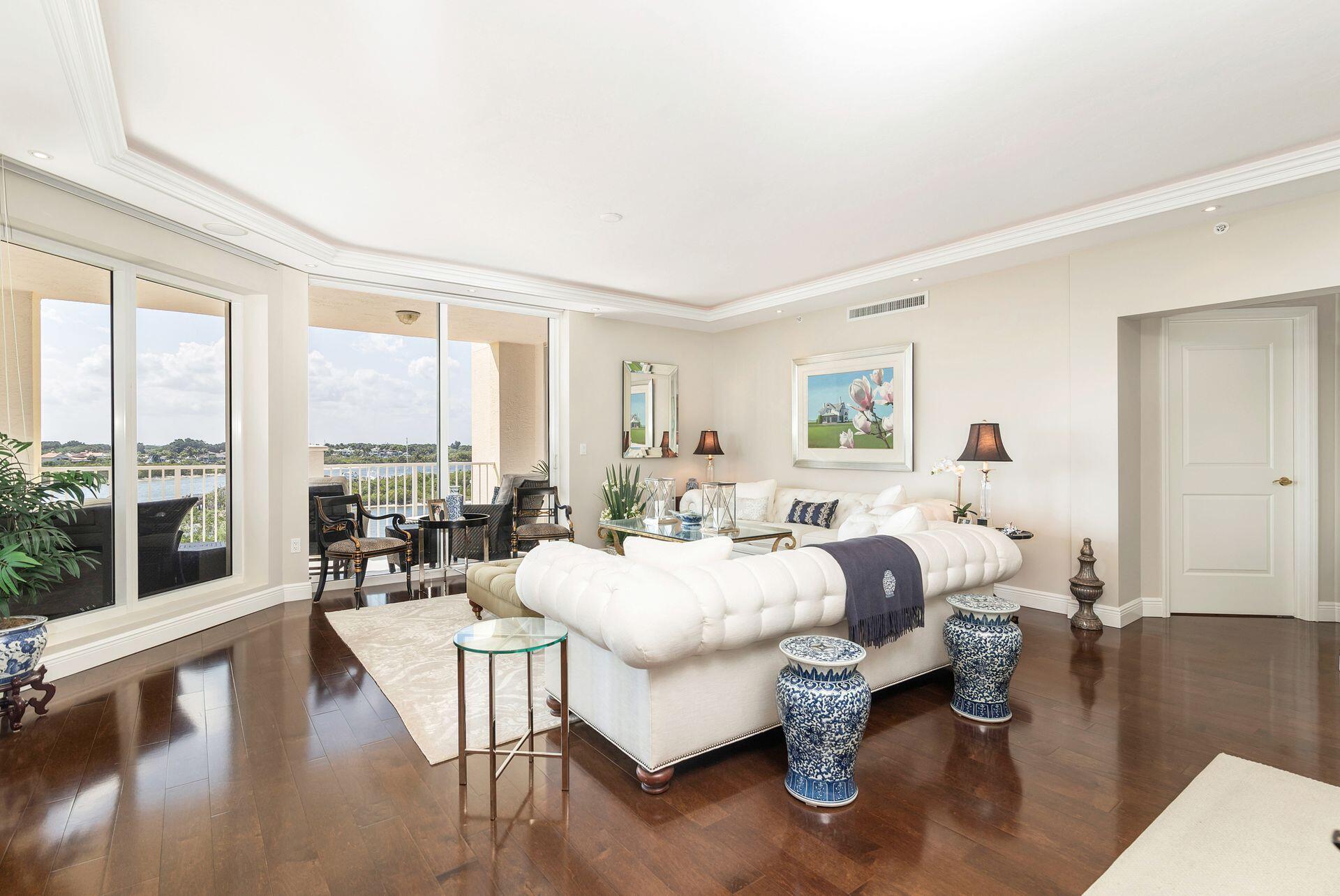 700 Highway 1, Unit 401 Jupiter, FL 33477 - Photo 13 of 39 a living room with furniture large windows and wooden floor