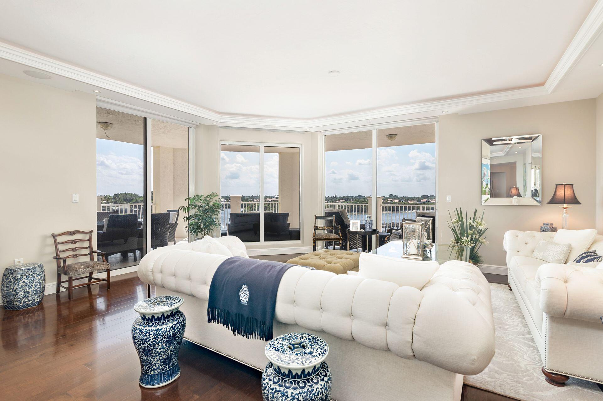 700 Highway 1, Unit 401 Jupiter, FL 33477 - Photo 14 of 39 a bedroom with a large bed and a large window