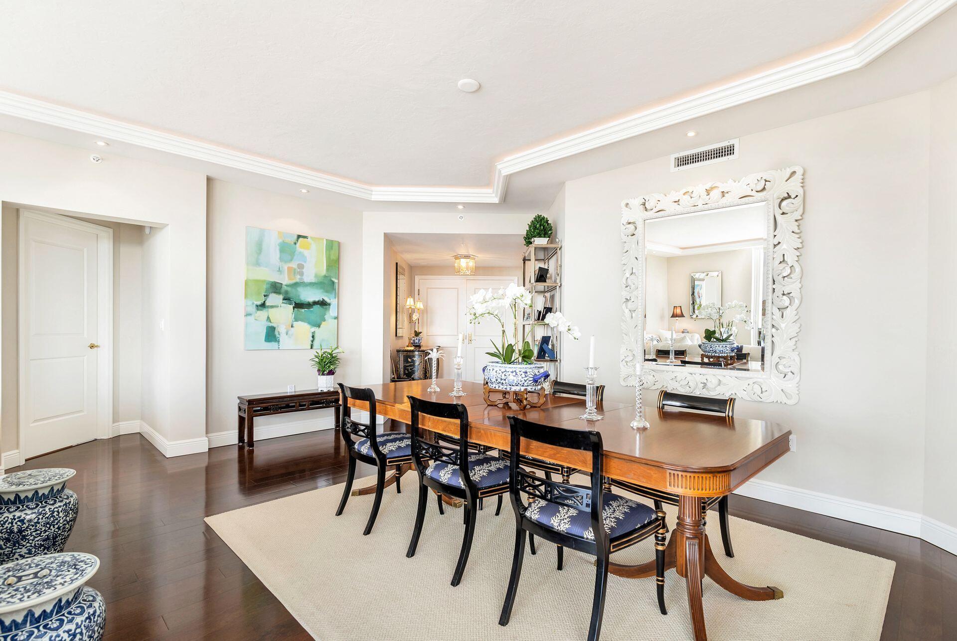 700 Highway 1, Unit 401 Jupiter, FL 33477 - Photo 15 of 39 a view of a dining room with furniture and wooden floor