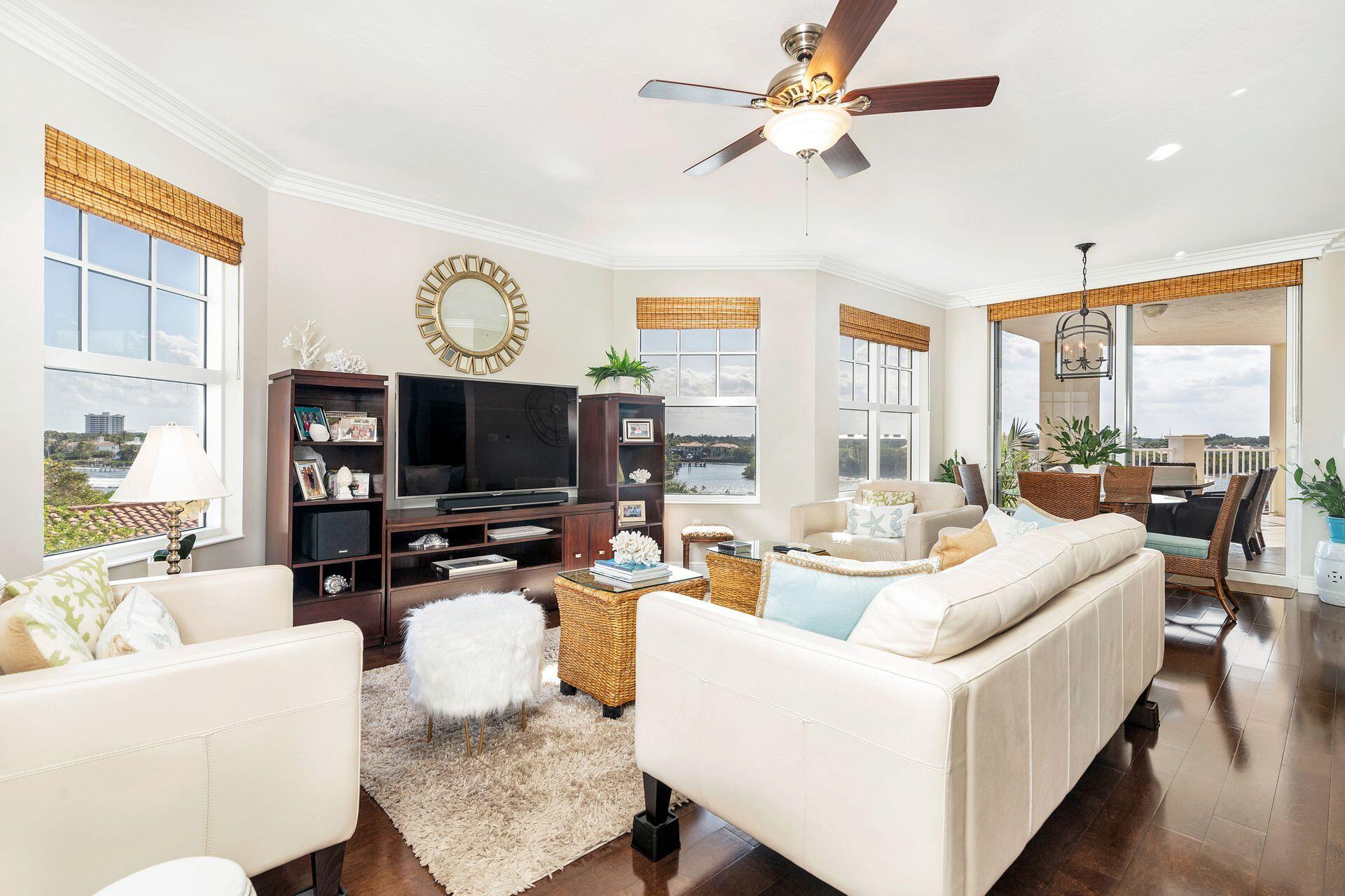 700 Highway 1, Unit 401 Jupiter, FL 33477 - Photo 21 of 39 a living room with fireplace furniture and a flat screen tv