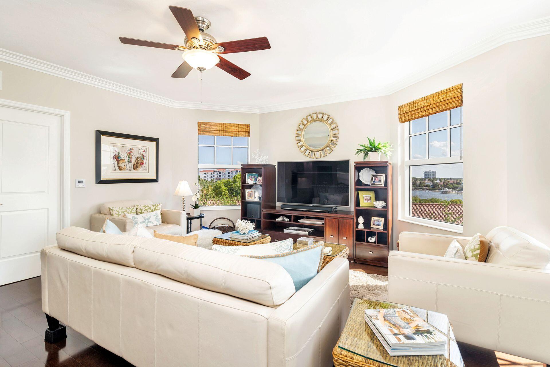 700 Highway 1, Unit 401 Jupiter, FL 33477 - Photo 22 of 39 a living room with furniture a flat screen tv and a window