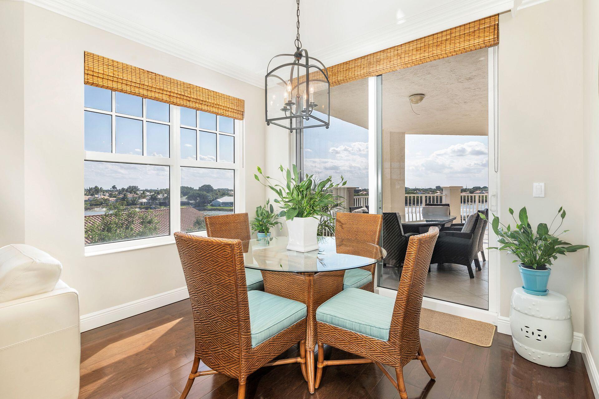 700 Highway 1, Unit 401 Jupiter, FL 33477 - Photo 23 of 39 a dining room with furniture window and wooden floor
