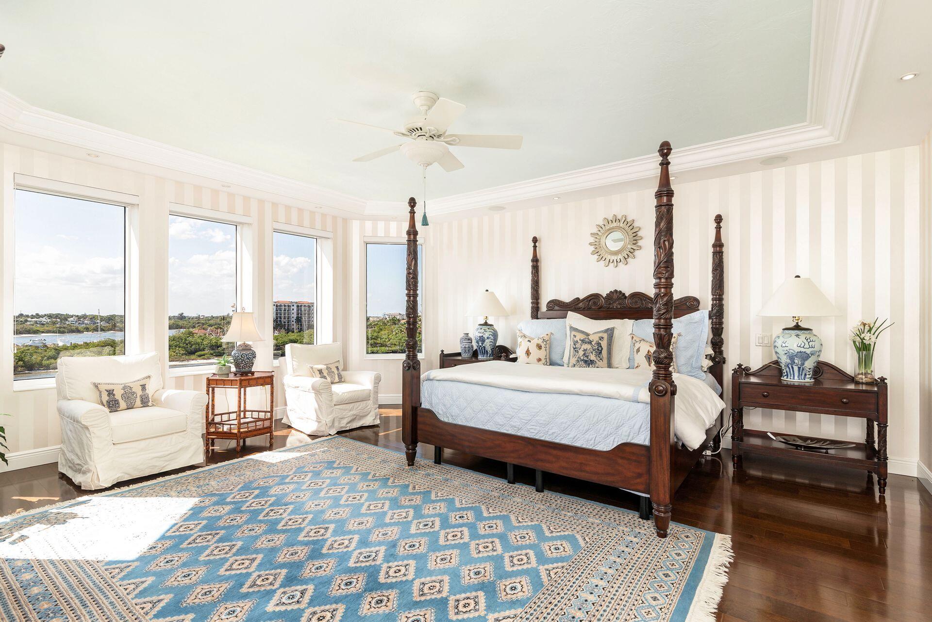 700 Highway 1, Unit 401 Jupiter, FL 33477 - Photo 24 of 39 a spacious bedroom with a bed and large windows