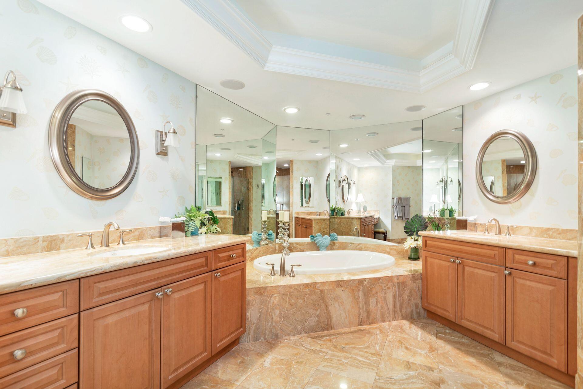 700 Highway 1, Unit 401 Jupiter, FL 33477 - Photo 26 of 39 a large bathroom with a large tub and sink
