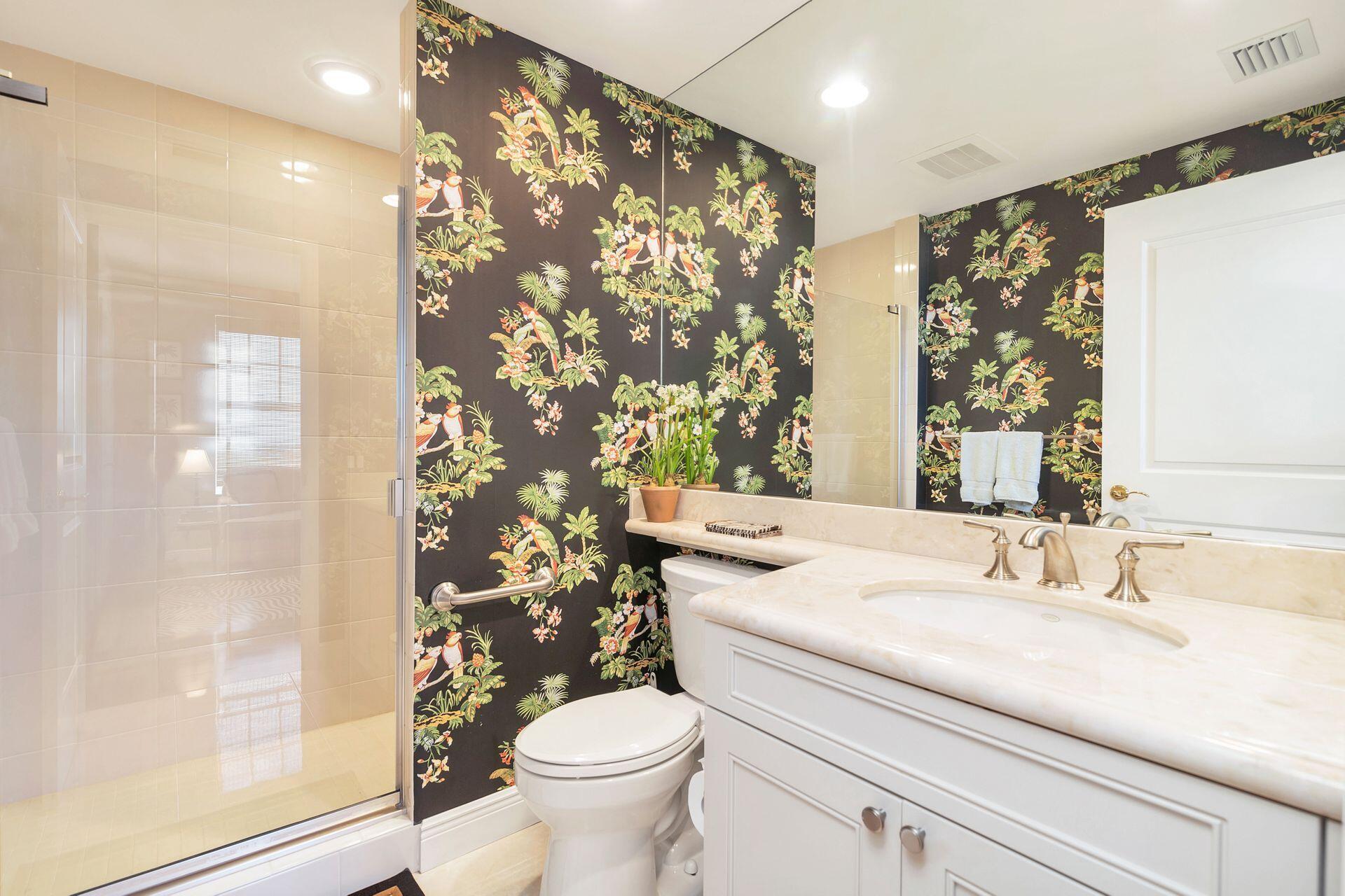 700 Highway 1, Unit 401 Jupiter, FL 33477 - Photo 29 of 39 a bathroom with a sink toilet and shower