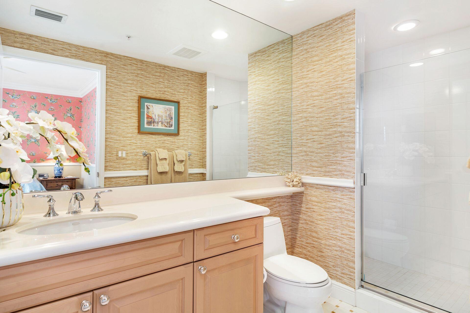 700 Highway 1, Unit 401 Jupiter, FL 33477 - Photo 31 of 39 a bathroom with a sink a toilet and shower