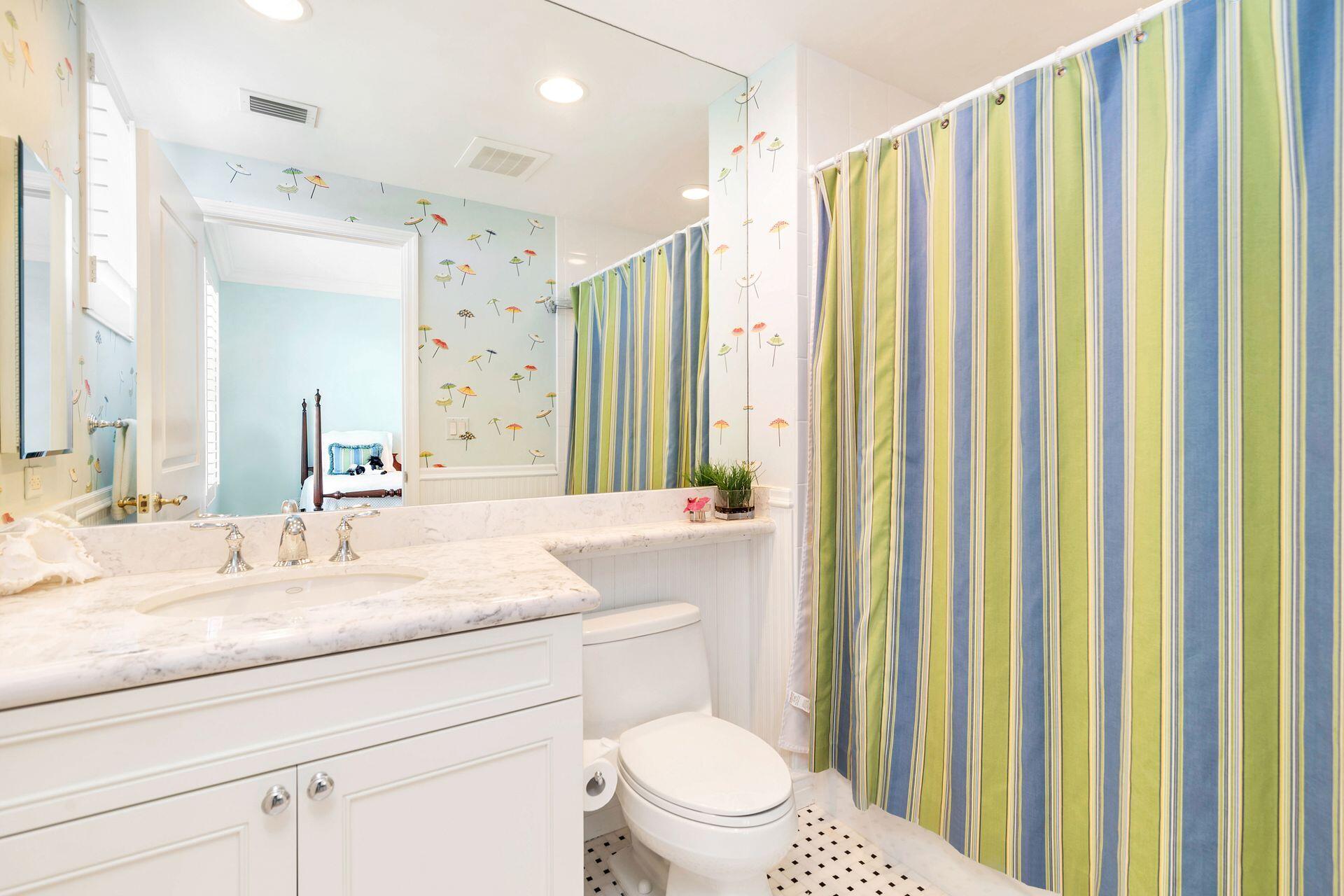 700 Highway 1, Unit 401 Jupiter, FL 33477 - Photo 33 of 39 a bathroom with a granite countertop sink and a mirror with toilet