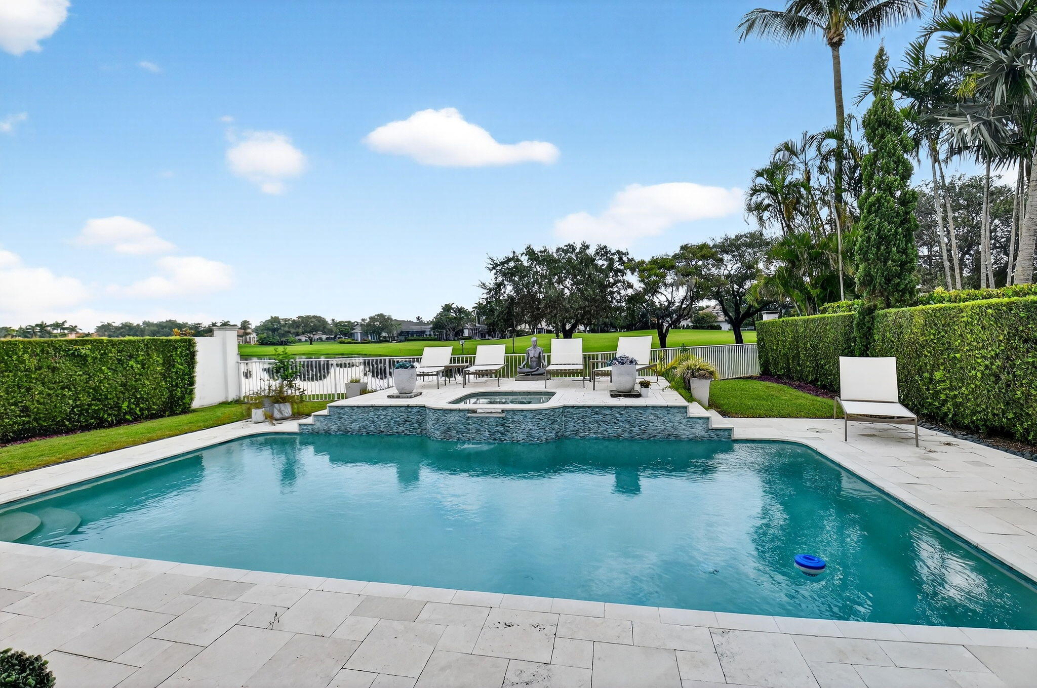 2563 Northwest 63rd Street Boca Raton, FL 33496 - Photo 49 of 65 a view of a swimming pool with a patio