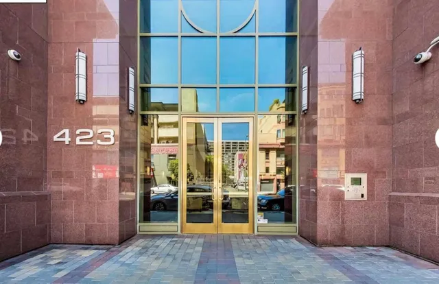 a view of a brick house with a large windows