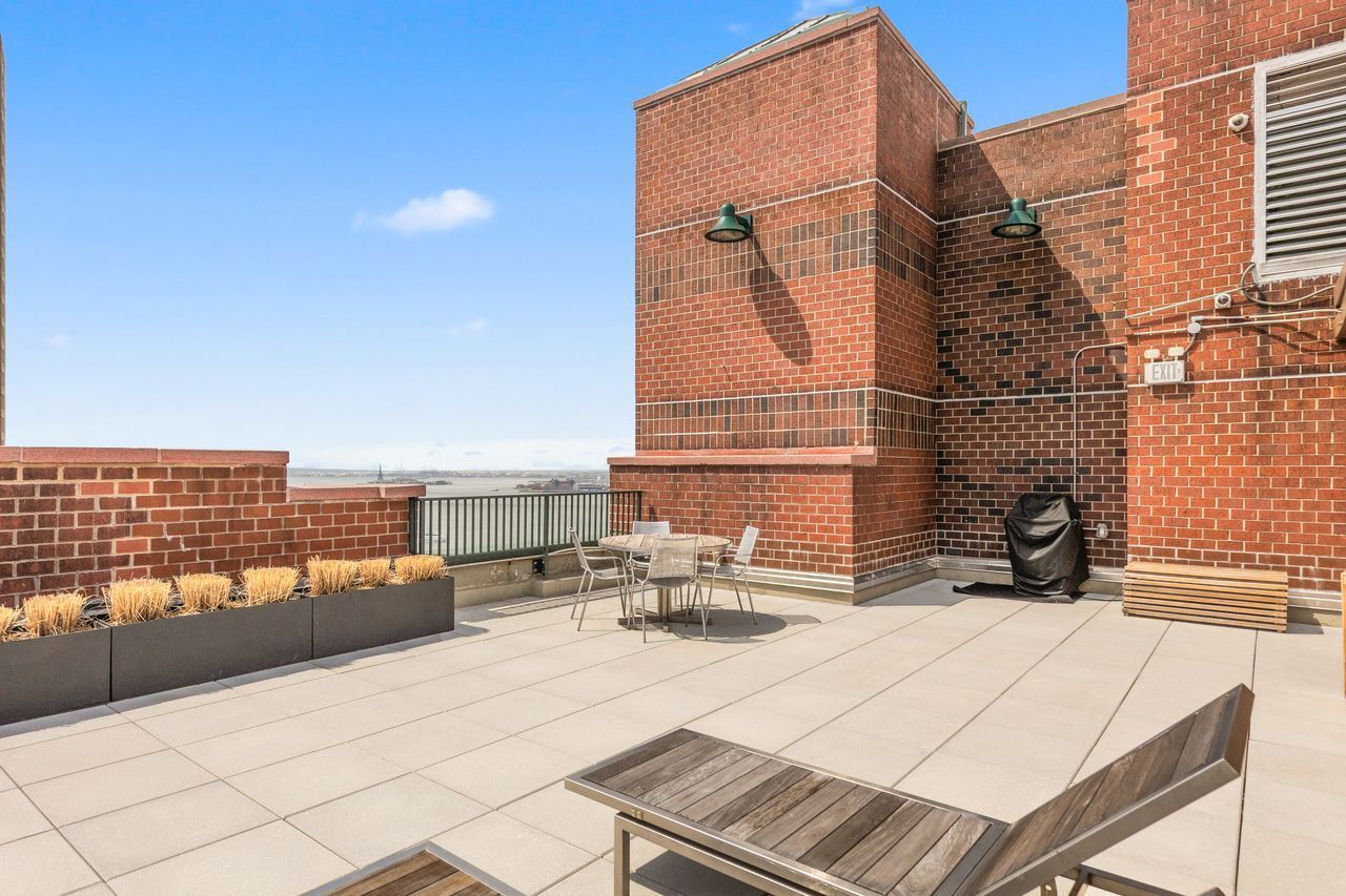 225 Rector Place, Unit 22J Manhattan, NY 10280 - Photo 7 of 8 a view of balcony with couch