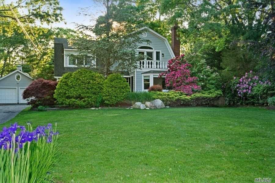 65 Aspatuck Road Westhampton Beach, NY 11978 - Photo 1 of 1 a front view of a house with a yard