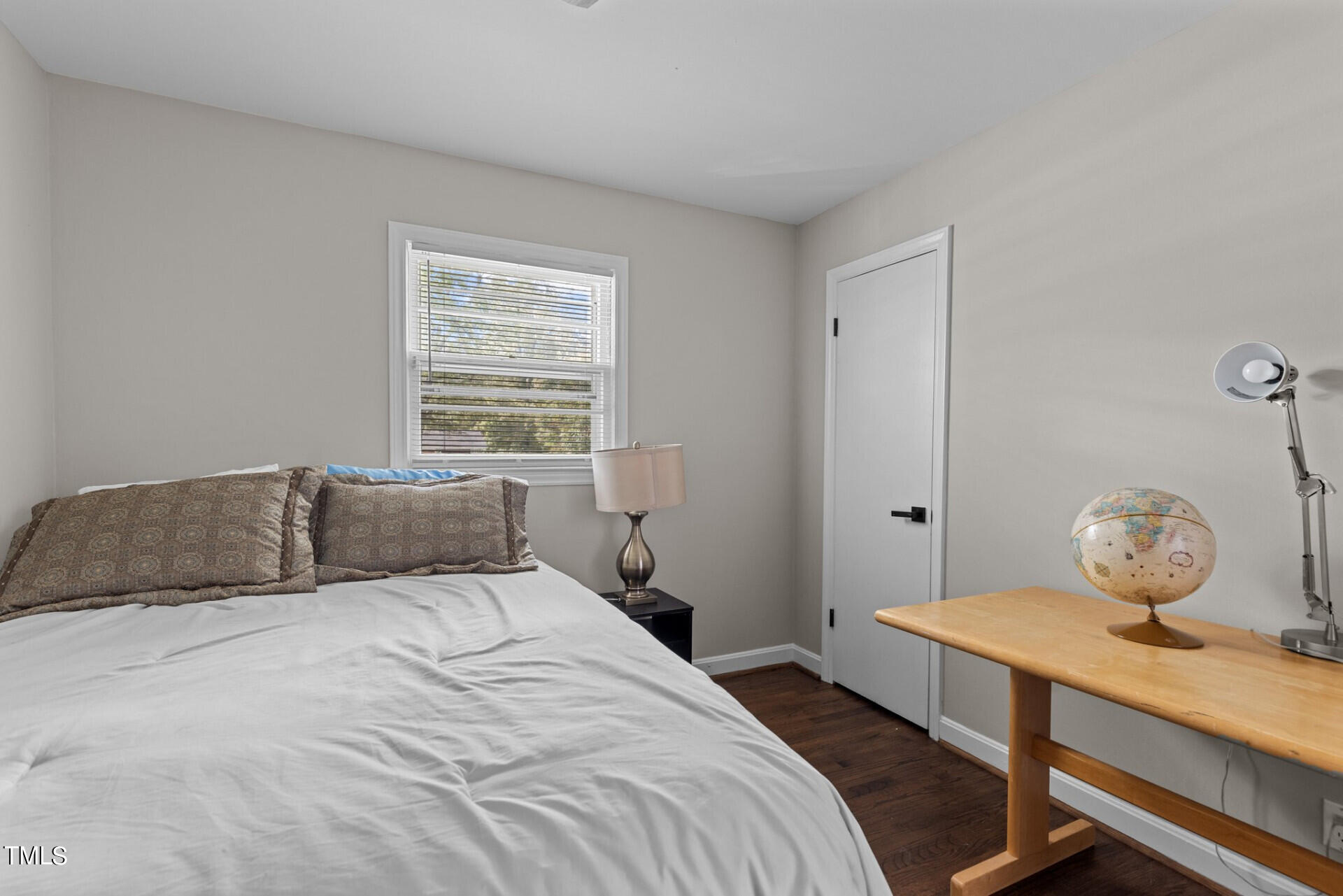 4828 Stafford Drive Durham, NC 27705 - Photo 12 of 22 a bedroom with a bed and window