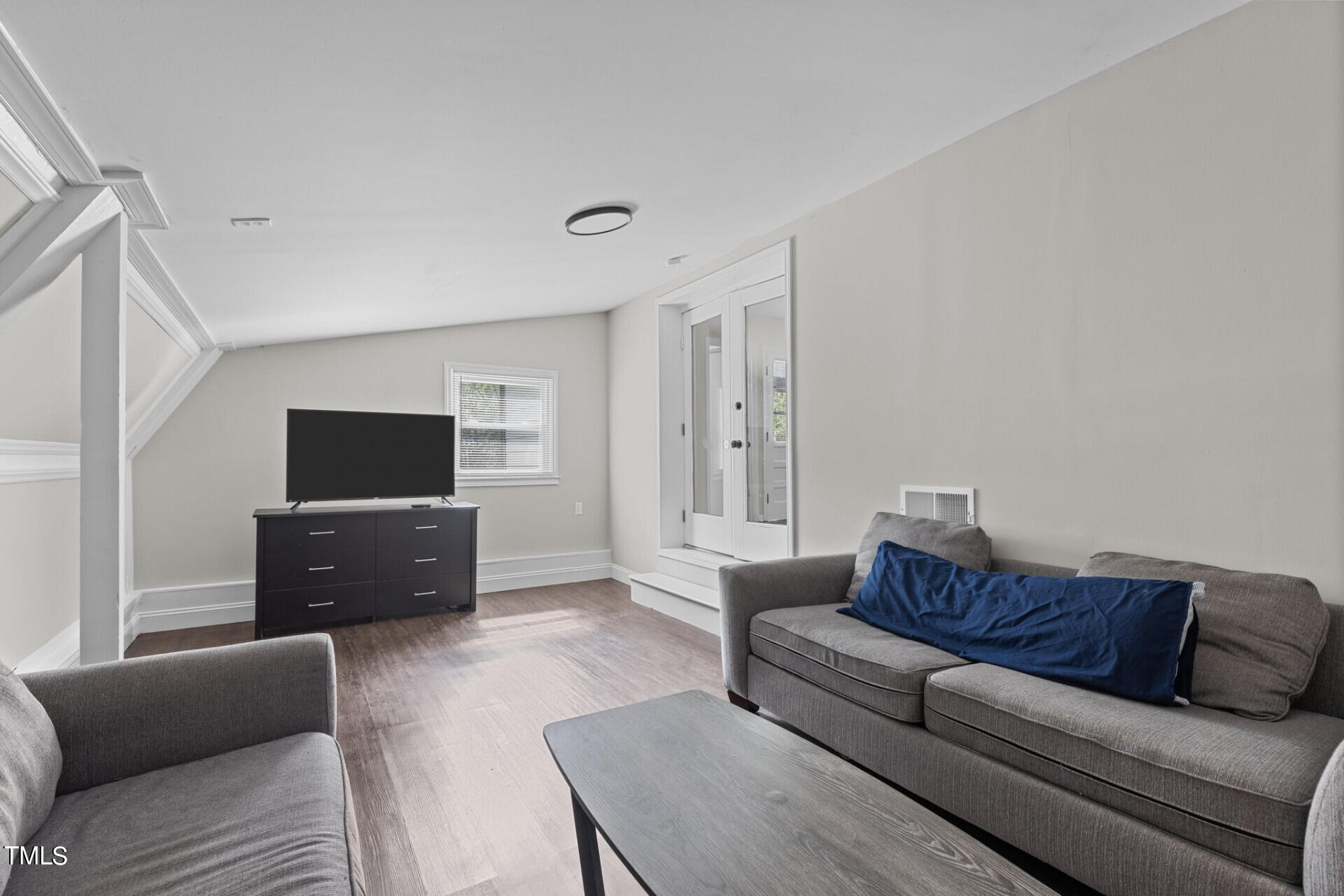 4828 Stafford Drive Durham, NC 27705 - Photo 14 of 22 a living room with furniture and a flat screen tv