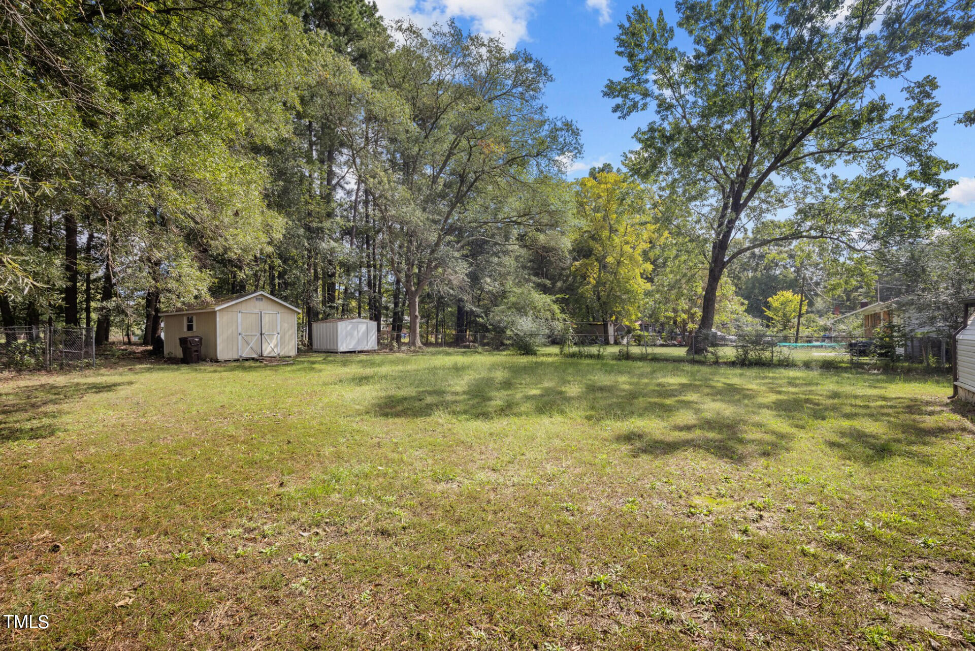 4828 Stafford Drive Durham, NC 27705 - Photo 19 of 22 a view of a house with a yard