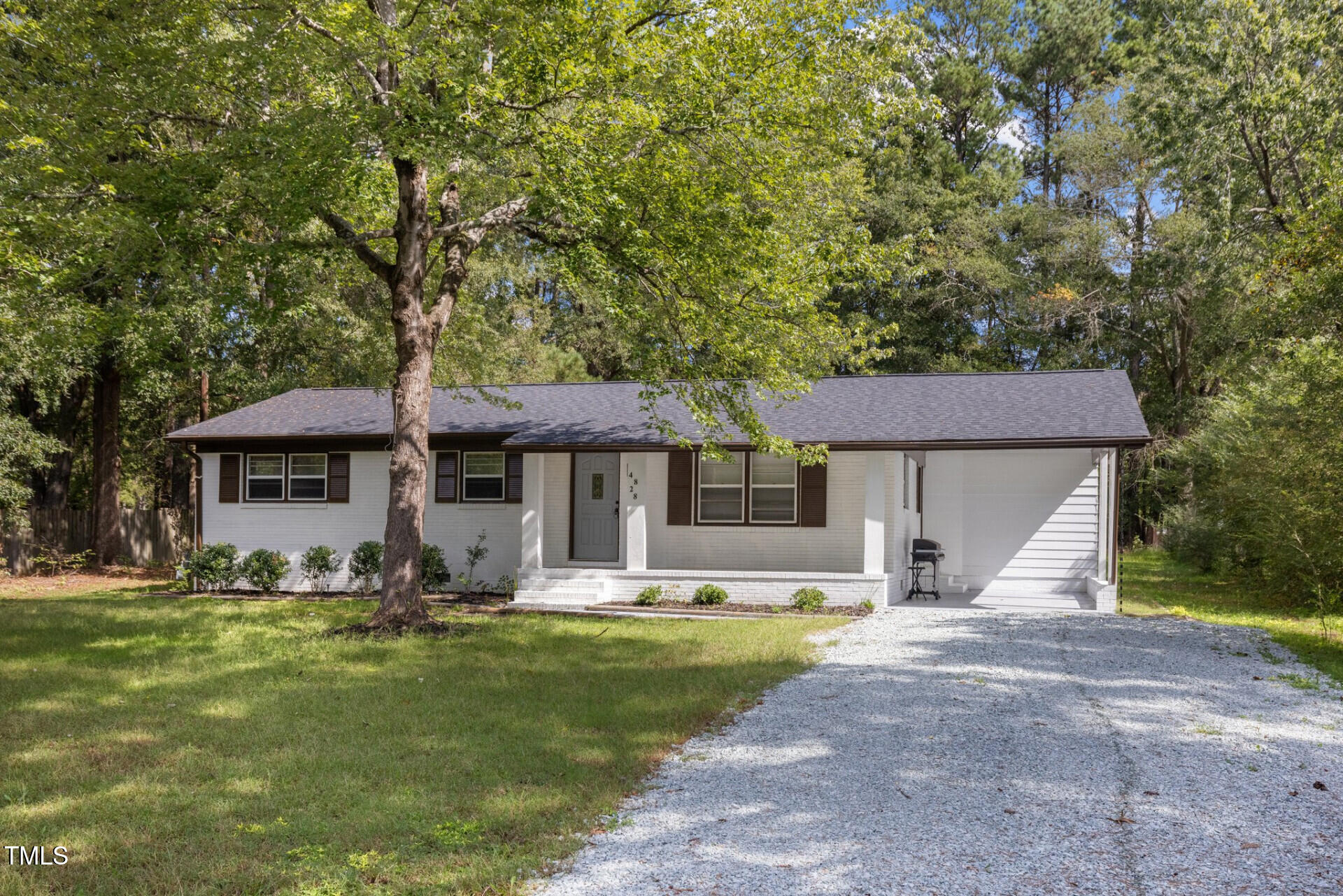4828 Stafford Drive Durham, NC 27705 - Photo 2 of 22 a front view of a house with garden