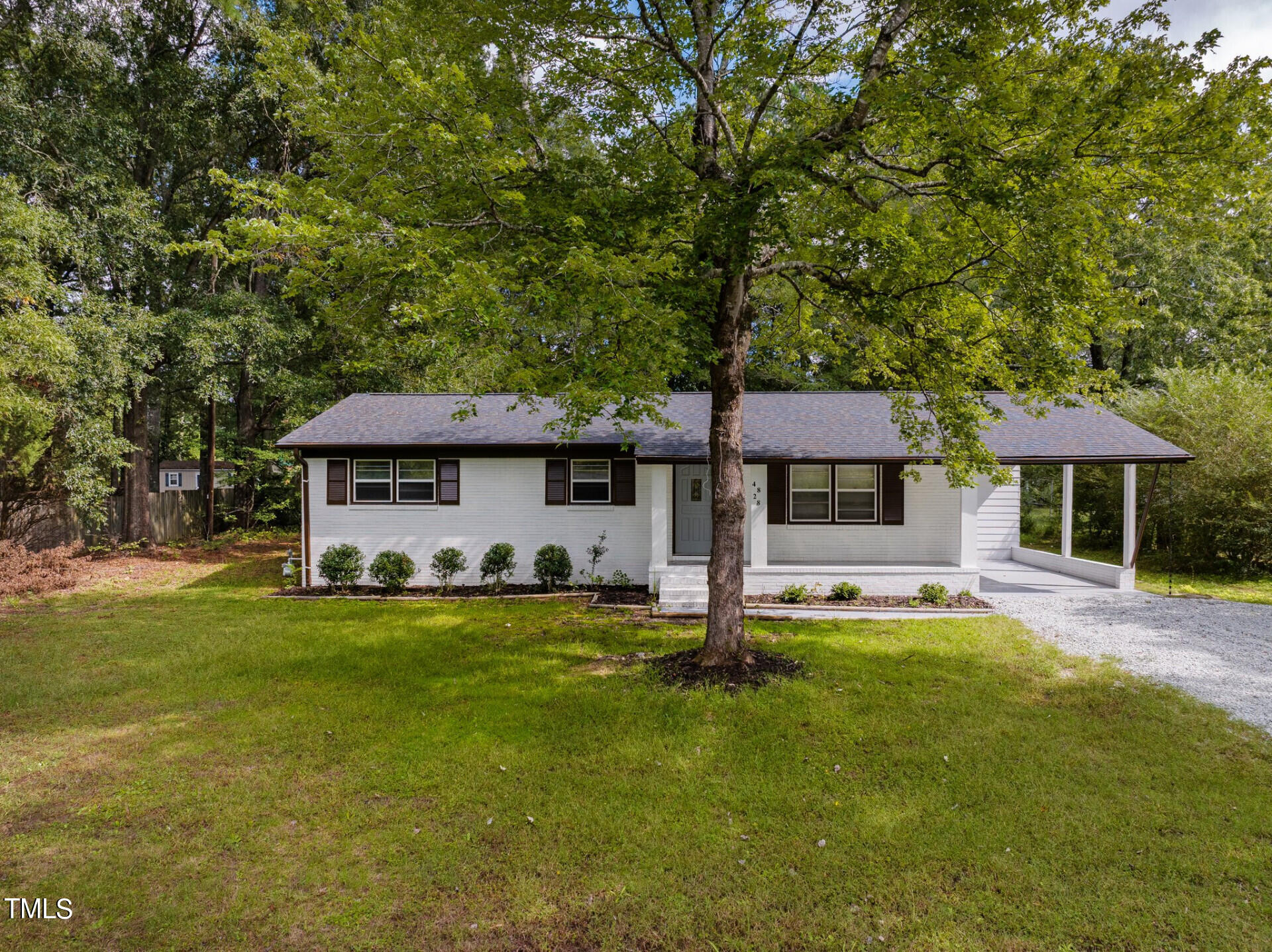 4828 Stafford Drive Durham, NC 27705 - Photo 22 of 22 a front view of a house with a garden