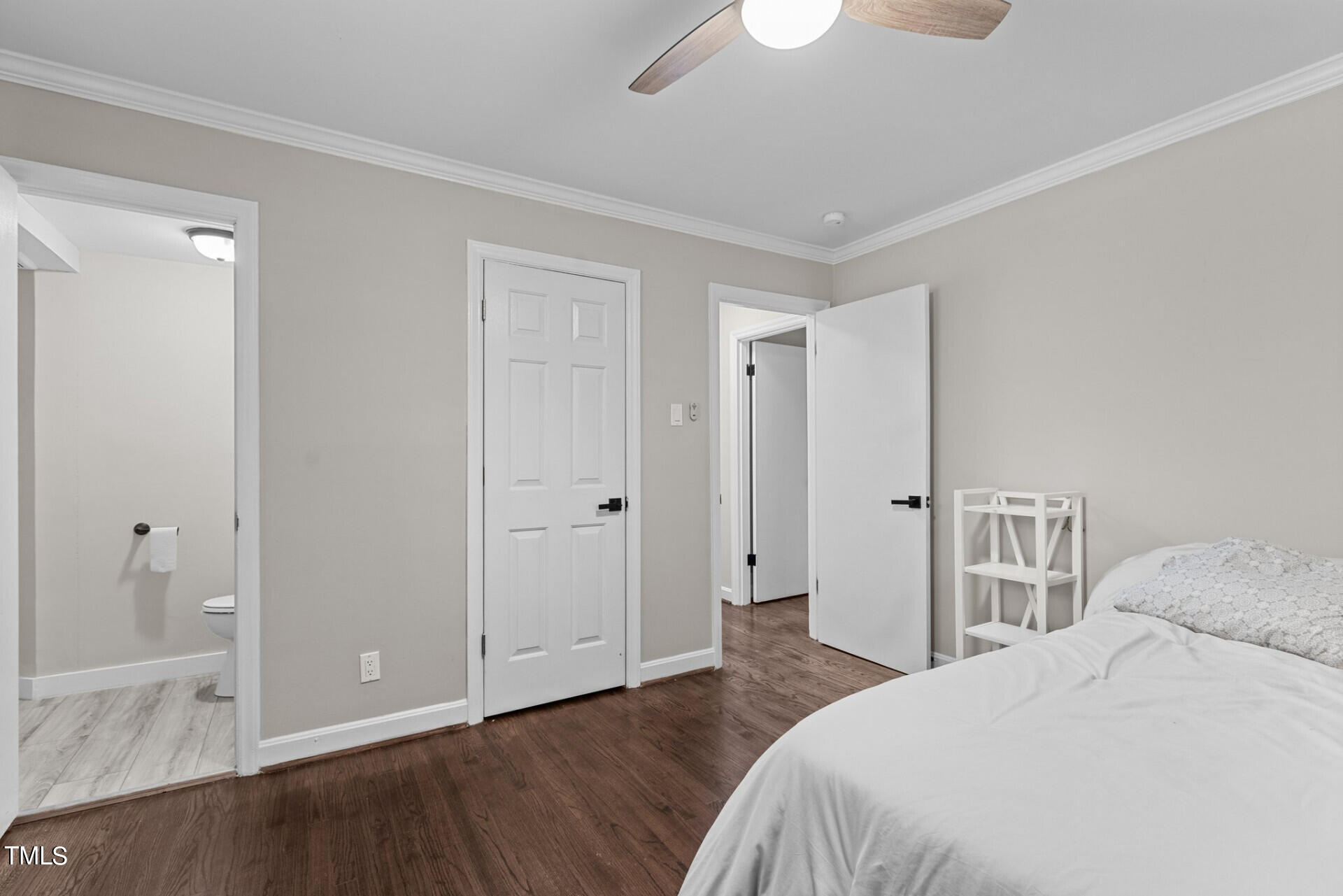 4828 Stafford Drive Durham, NC 27705 - Photo 7 of 22 a bedroom with a bed and wooden floor
