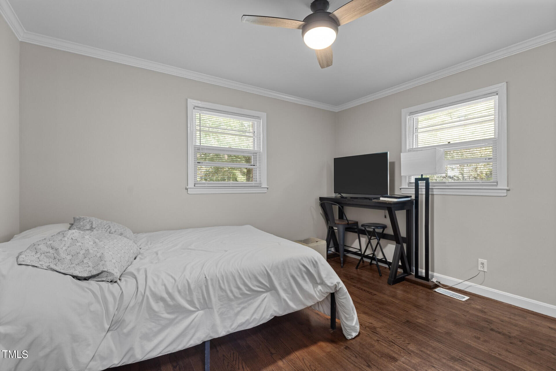 4828 Stafford Drive Durham, NC 27705 - Photo 8 of 22 a bedroom with a bed and a table