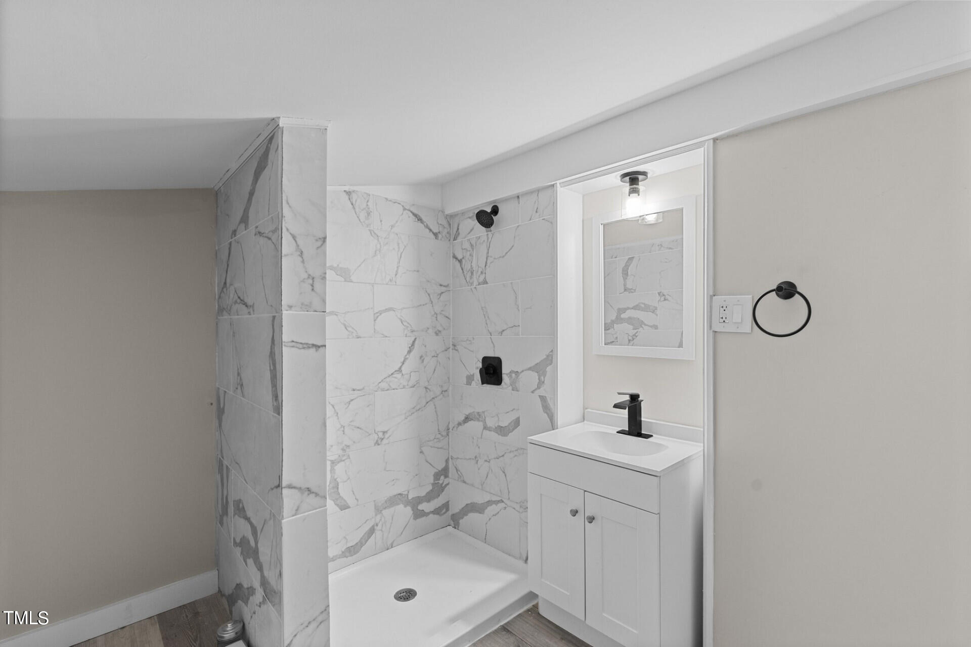 4828 Stafford Drive Durham, NC 27705 - Photo 10 of 22 a bathroom with a sink a toilet and shower