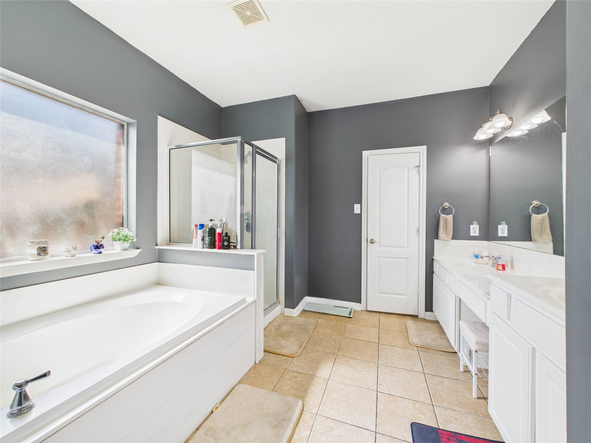 1484 Allison Street Alvin, TX 77511 - Photo 21 of 37 Primary bathroom offers large soaking tub, stand up shower, and double vanities