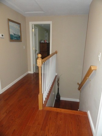 128 Brandy Hill Road Thompson, CT 06277 - Photo 13 of 26 a view of a hallway with wooden floor and stairs