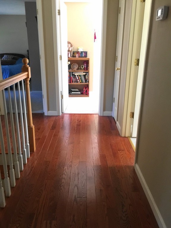 128 Brandy Hill Road Thompson, CT 06277 - Photo 14 of 26 a view of an empty room with wooden floor and a window