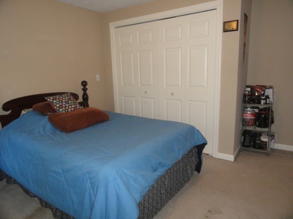 128 Brandy Hill Road Thompson, CT 06277 - Photo 15 of 26 a bedroom with a bed and a window